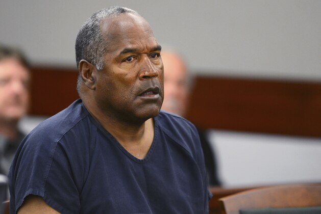 FILE - In this May 14, 2013, file photo, O.J. Simpson appears at an evidentiary hearing in Clark County District Court in Las Vegas. A Nevada prison official said early Sunday, Oct. 1, 2017, O.J. Simpson, the former football legend and Hollywood star, has been released from a Nevada prison in Lovelock after serving nine years for armed robbery. (Ethan Miller via AP, Pool, File)
