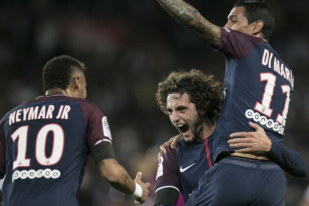 PSG's Adrien Rabiot, center, PSG's Angel Di Maria smile to PSG's Neymar, left, after scoring during the French League One soccer match between PSG and Toulouse at the Parc des Princes stadium in Paris, France, Sunday, Aug. 20, 2017. (AP Photo/Kamil Zihnioglu)