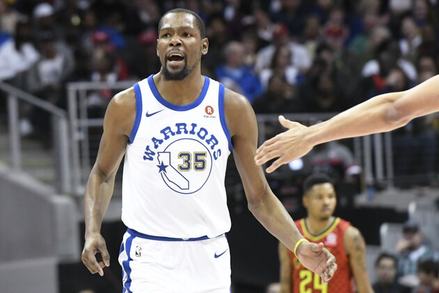 Golden State Warriors forward Kevin Durant is congratulated after a score during an NBA basketball game against the Atlanta Hawks Friday, March 2, 2018, in Atlanta. (AP Photo/John Amis)