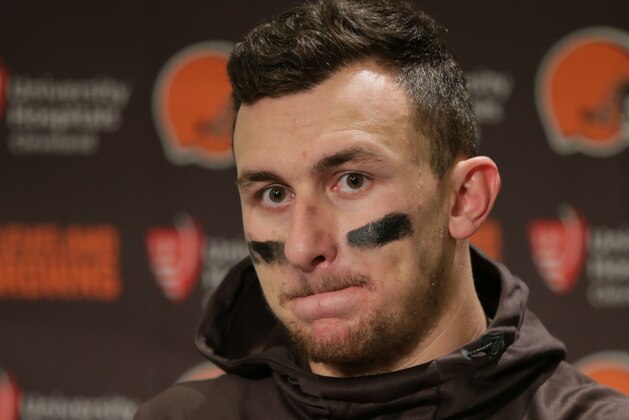 FILE - In this Dec. 20, 2015, file photo, Cleveland Browns quarterback Johnny Manziel speaks with media members following the team's 30-13 loss to the Seattle Seahawks in an NFL football game, in Seattle. Manziel has been suspended for the first four games of next season for violating the NFL's substance-abuse policy.The suspension announced Thursday, June 30, 2016, is not related to the NFL's domestic violence policy, but the free agent quarterback would be subject to it if he signs with another team. (AP Photo/Scott Eklund, File)