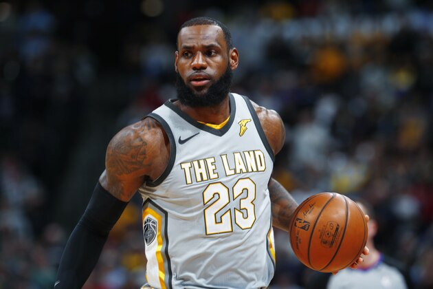 Cleveland Cavaliers forward LeBron James brings the ball up the court against the Denver Nuggets in the first half of an NBA basketball game Wednesday, March 7, 2018, in Denver. (AP Photo/David Zalubowski)