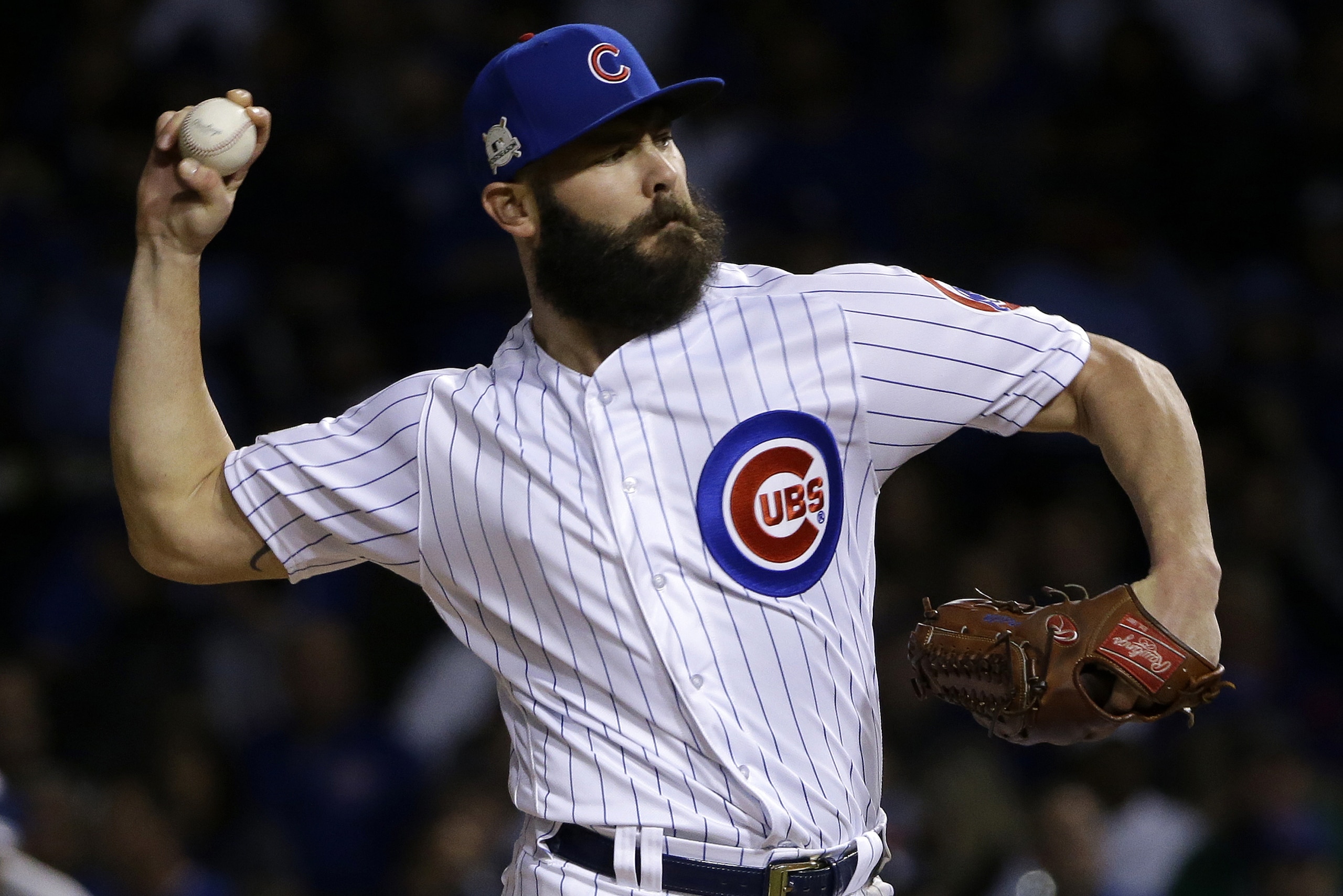 FILE - In this Wednesday, Oct. 18, 201,7 file photo, Chicago Cubs starting pitcher Jake Arrieta throws during the first inning of Game 4 of baseball's National League Championship Series against the Los Angeles Dodgers in Chicago. Cubs pitchers Arrieta and Wade Davis  were among nine free agents who turned down $17.4 million qualifying offers from their teams Thursday, Nov. 16, 2017. (AP Photo/Nam Y. Huh, File)