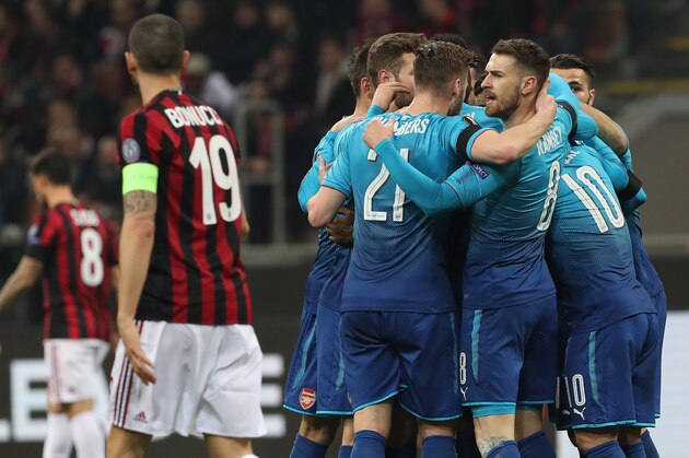 MILAN, ITALY - MARCH 08:  Henrikh Mkhitaryan of Arsenal celebrates with his team-mates after scoring the opening goal during UEFA Europa League Round of 16 match between AC Milan and Arsenal at the San Siro on March 8, 2018 in Milan, Italy.  (Photo by Marco Luzzani/Getty Images)