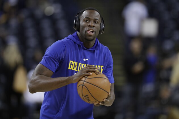 Golden State Warriors' Draymond Green warms up before an NBA basketball game against the Oklahoma City Thunder Tuesday, Feb. 6, 2018, in Oakland, Calif. (AP Photo/Marcio Jose Sanchez)