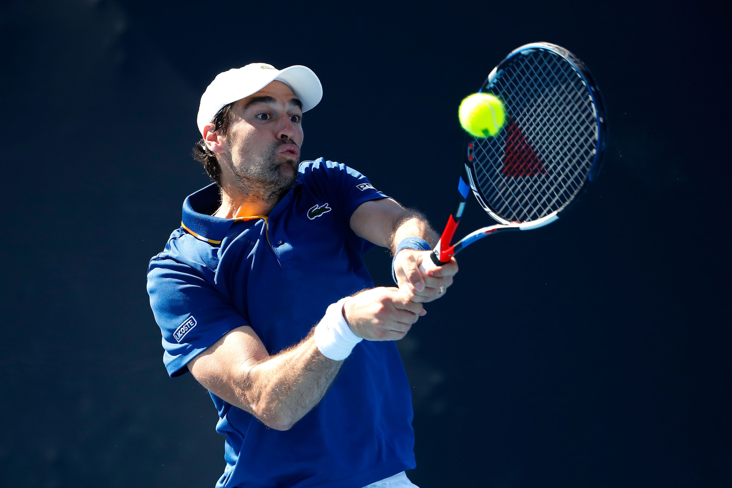 MELBOURNE, AUSTRALIA - JANUARY 16:  Jeremy Chardy of France plays a backhand in his first round match against Tennys Sandgren of the United States on day two of the 2018 Australian Open at Melbourne Park on January 16, 2018 in Melbourne, Australia.  (Photo by Scott Barbour/Getty Images)