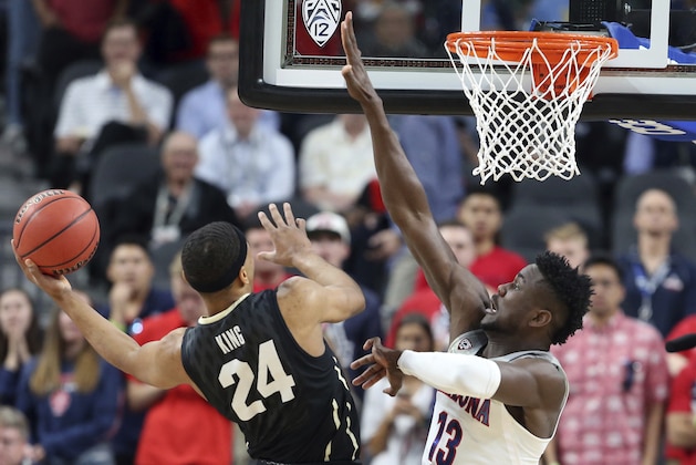 Colorado's George King (24) shoots as Arizona's Deandre Ayton defends during the first half of an NCAA college basketball game in the quarterfinals of the Pac-12 men's tournament Thursday, March 8, 2018, in Las Vegas. (AP Photo/Isaac Brekken)