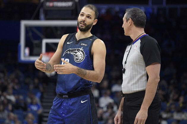Orlando Magic guard Evan Fournier (10) talks with official J.T. Orr, right, during the first half of an NBA basketball game against the Memphis Grizzlies Saturday, March 3, 2018, in Orlando, Fla. (AP Photo/Phelan M. Ebenhack)