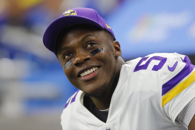 Minnesota Vikings quarterback Teddy Bridgewater smiles on the bench against the Detroit Lions during an NFL football game in Detroit, Thursday, Nov. 23, 2017. (AP Photo/Paul Sancya)