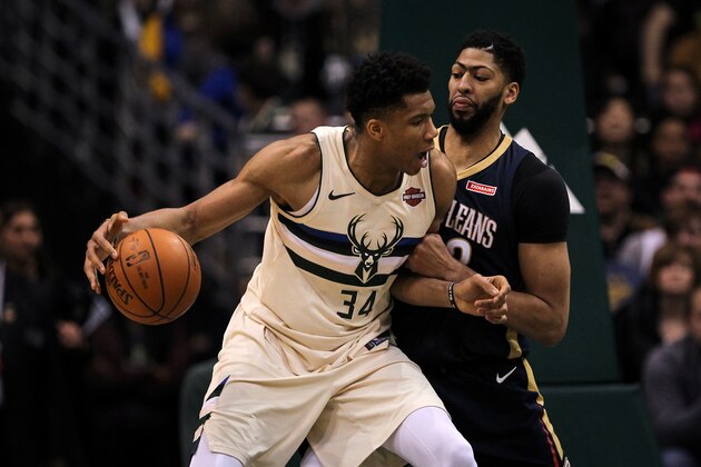 MILWAUKEE, WI - FEBRUARY 25:  Giannis Antetokounmpo #34 of the Milwaukee Bucks dribbles the ball while being guarded by Anthony Davis #23 of the New Orleans Pelicans in the fourth quarter at the Bradley Center on February 25, 2018 in Milwaukee, Wisconsin. NOTE TO USER: User expressly acknowledges and agrees that, by downloading and or using this photograph, User is consenting to the terms and conditions of the Getty Images License Agreement. (Dylan Buell/Getty Images)