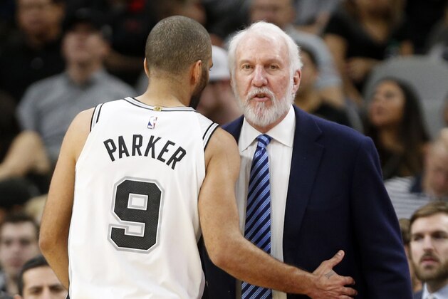 SAN ANTONIO,TX - MARCH 5 : Tony Parker #9 of the San Antonio Spurs talks with head coach Gregg Popovich at AT&T Center on March 5, 2018  in San Antonio, Texas.  NOTE TO USER: User expressly acknowledges and agrees that , by downloading and or using this photograph, User is consenting to the terms and conditions of the Getty Images License Agreement. (Photo by Ronald Cortes/Getty Images)