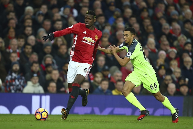 FILE - In this Sunday, Jan. 15, 2017 file photo, Manchester United's Paul Pogba, left, competes for the ball with Liverpool's Trent Alexander-Arnold during their English Premier League soccer match at Old Trafford stadium in Manchester, England. The 18-year-old right back made his senior debut for Liverpool in October and has only started two Premier League games. But such was the maturity he showed during his first-team opportunities - notably in a 1-1 draw at Manchester United in January - that regular starter Nathaniel Clyne could soon be under pressure for his place. (AP Photo/Dave Thompson, file)