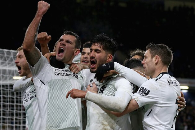BURNLEY, ENGLAND - JANUARY 01:  Dejan Lovren of Liverpool and Emre Can of Liverpool celebrate there sides second goal of the game during the Premier League match between Burnley and Liverpool at Turf Moor on January 1, 2018 in Burnley, England.  (Photo by Nigel Roddis/Getty Images)