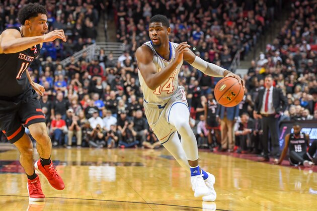 LUBBOCK, TX - FEBRUARY 24: Malik Newman #14 of the Kansas Jayhawks drives to the basket against Zach Smith #11 of the Texas Tech Red Raiders during the game on February 24, 2018 at United Supermarket Arena in Lubbock, Texas. Kansas defeated Texas Tech 74-72. (Photo by John Weast/Getty Images)
