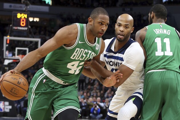 Boston Celtics's Al Horford, left, of Dominican Republic , drives around Minnesota Timberwolves' Taj Gibson as Kyrie Irving, right, sets a pick in the first half of an NBA basketball game Thursday, March 8, 2018, in St. Paul, Minn. (AP Photo/Jim Mone)