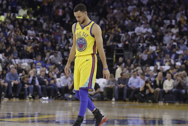 Golden State Warriors guard Stephen Curry (30) walks on the court to shoot free throws during the first half of an NBA basketball game against the San Antonio Spurs in Oakland, Calif., Thursday, March 8, 2018. (AP Photo/Jeff Chiu)