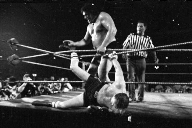 FILE - In this June 26, 1976, file photo, professional wrestler Andre the Giant tosses heavyweight contender Chuck Wepner out of the ring for a third round victory in a boxer vs. wrestler match, at Shea Stadium in New York. The freak show Floyd Mayweather Jr. and Conor McGregor are talking about probably won't happen, though stranger things have happened.  (AP Photo/File)
