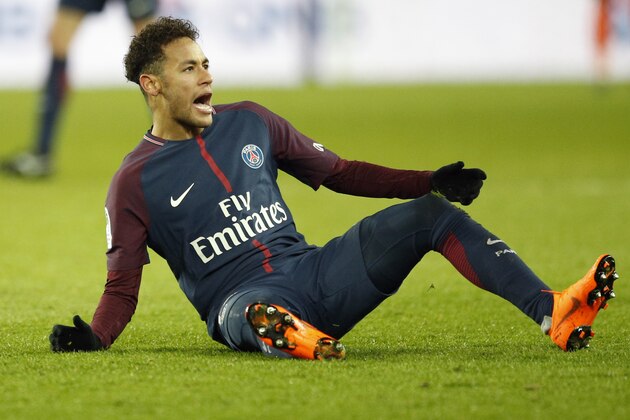 PSG's Neymar reacts after falling during the French League One soccer match between Paris Saint Germain and Strasbourg, at the Parc des Princes stadium in Paris, France, Saturday, Feb. 17, 2018. (AP Photo/Francois Mori)