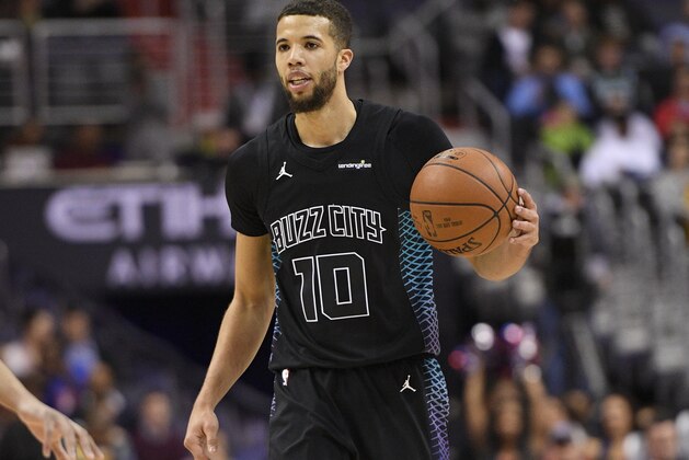 Charlotte Hornets guard Michael Carter-Williams (10) dribbles the ball during the first half of an NBA basketball game against the Washington Wizards, Friday, Feb. 23, 2018, in Washington. (AP Photo/Nick Wass)