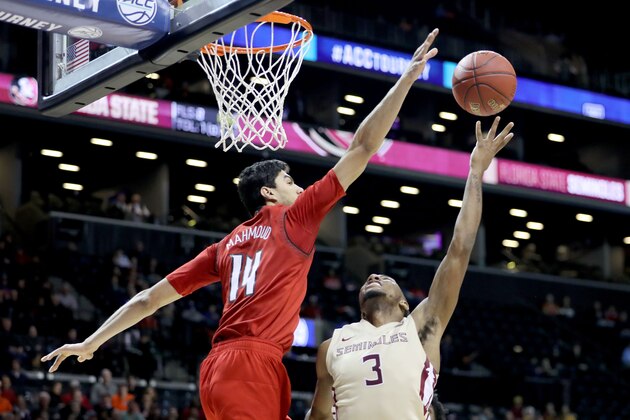 NEW YORK, NY - MARCH 07: Trent Forrest #3 of the Florida State Seminoles takes a shot against Anas Mahmoud #14 of the Louisville Cardinals in the second half during the second round of the ACC Men's Basketball Tournament at Barclays Center on March 7, 2018 in New York City.  (Photo by Abbie Parr/Getty Images)