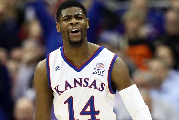 KANSAS CITY, MO - MARCH 08:  Malik Newman #14 of the Kansas Jayhawks reacts after scoring during the Big 12 Basketball Tournament quarterfinal game against the Oklahoma State Cowboys at the Sprint Center on March 8, 2018 in Kansas City, Missouri.  (Photo by Jamie Squire/Getty Images)