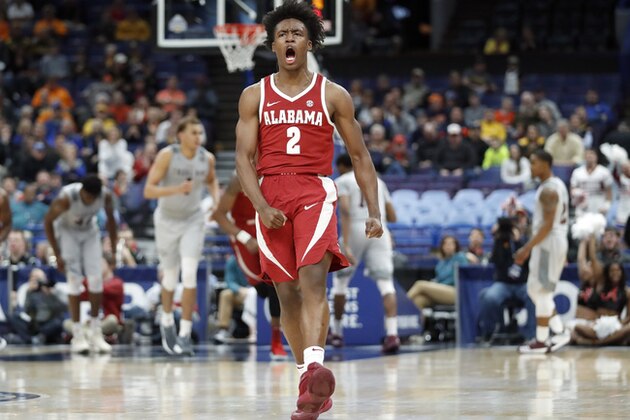 Alabama's Collin Sexton celebrates after a teammate's basket during the second half in an NCAA college basketball game against Texas A&M at the Southeastern Conference tournament Thursday, March 8, 2018, in St. Louis. Alabama won 71-70. (AP Photo/Jeff Roberson)