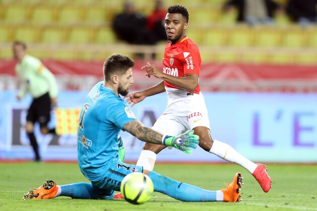 Monaco's French midfielder Thomas Lemar (R) vies with Bordeaux's French goalkeeper Benoit Costil (L) during the French L1 football match Monaco vs Bordeaux on March 02, 2018 at the 'Louis II Stadium' in Monaco. / AFP PHOTO / VALERY HACHE        (Photo credit should read VALERY HACHE/AFP/Getty Images)