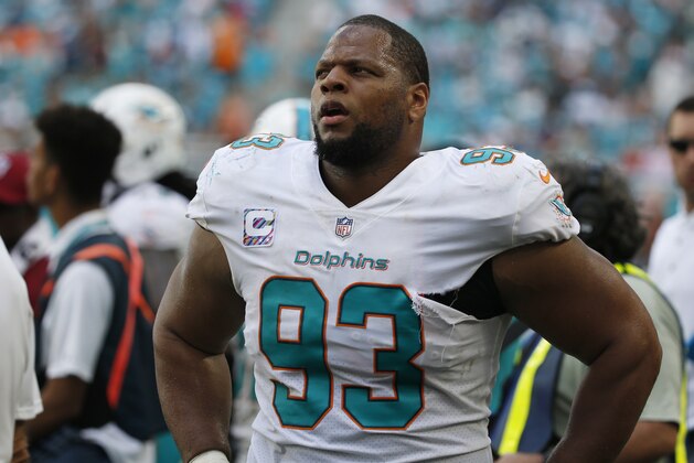 Miami Dolphins defensive tackle Ndamukong Suh (93) looks up from the sidelines, during the second half of an NFL football game against the Tennessee Titans, Sunday, Oct. 8, 2017, in Miami Gardens, Fla. (AP Photo/Wilfredo Lee)