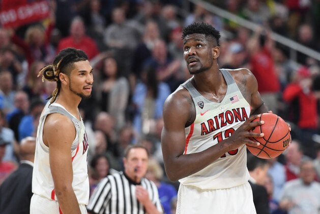LAS VEGAS, NV - MARCH 09:  Keanu Pinder #25 of the Arizona Wildcats looks on as teammate Deandre Ayton #13 holds the ball as they wait for the clock to expire in a semifinal game of the Pac-12 basketball tournament against the UCLA Bruins at T-Mobile Arena on March 9, 2018 in Las Vegas, Nevada. The Wildcats won 78-67 in overtime.  (Photo by Ethan Miller/Getty Images)