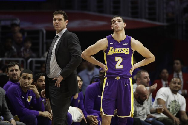 Los Angeles Lakers head coach Luke Walton, left, and Lonzo Ball watch action during the second half of an NBA basketball game against the Los Angeles Clippers, Monday, Nov. 27, 2017, in Los Angeles. The Clippers 120-115. (AP Photo/Jae C. Hong)