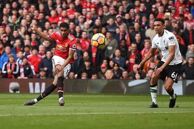 TOPSHOT - Manchester United's English striker Marcus Rashford (L) scores the opening goal during the English Premier League football match between Manchester United and Liverpool at Old Trafford in Manchester, north west England, on March 10, 2018. / AFP PHOTO / Oli SCARFF / RESTRICTED TO EDITORIAL USE. No use with unauthorized audio, video, data, fixture lists, club/league logos or 'live' services. Online in-match use limited to 75 images, no video emulation. No use in betting, games or single club/league/player publications.  /         (Photo credit should read OLI SCARFF/AFP/Getty Images)