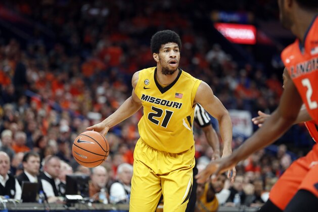 Missouri's Jordan Barnett (21) brings the ball down the court during the second half of an NCAA college basketball game against Illinois Saturday, Dec. 23, 2017, in St. Louis. Illinois won 70-64. (AP Photo/Jeff Roberson)