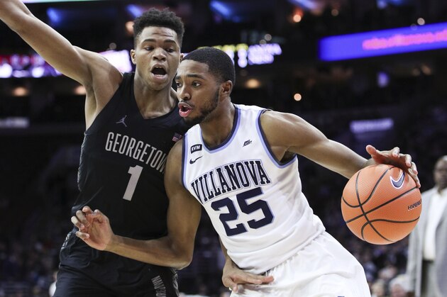Villanova's Mikal Bridges, right, drives to the basket against Georgetown's Jamorko Pickett, left, during the first half of an NCAA college basketball game, Saturday, March 3, 2018, in Philadelphia. (AP Photo/Chris Szagola)