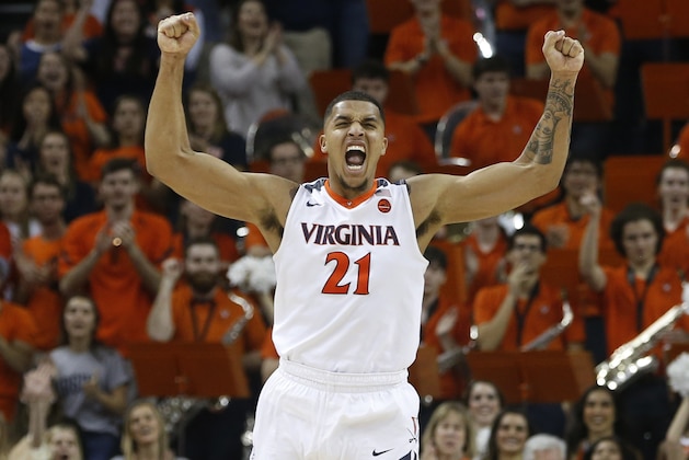 Virginia forward Isaiah Wilkins (21) celebrates his team's 62-57 win at the end of an NCAA college basketball game against Notre Dame in Charlottesville, Va., Saturday, March 3, 2018. (AP Photo/Steve Helber)