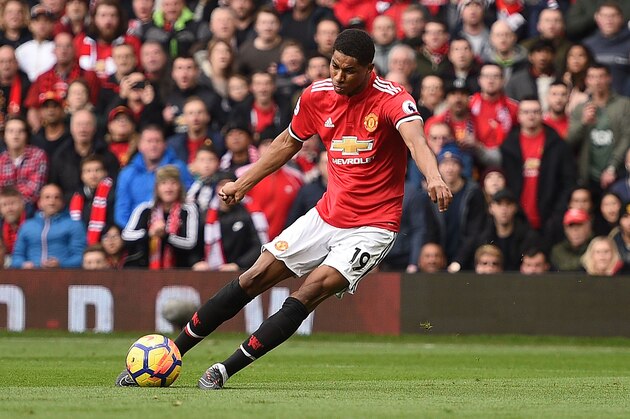 Manchester United's English striker Marcus Rashford scores the opening goal during the English Premier League football match between Manchester United and Liverpool at Old Trafford in Manchester, north west England, on March 10, 2018. / AFP PHOTO / Oli SCARFF / RESTRICTED TO EDITORIAL USE. No use with unauthorized audio, video, data, fixture lists, club/league logos or 'live' services. Online in-match use limited to 75 images, no video emulation. No use in betting, games or single club/league/player publications.  /         (Photo credit should read OLI SCARFF/AFP/Getty Images)