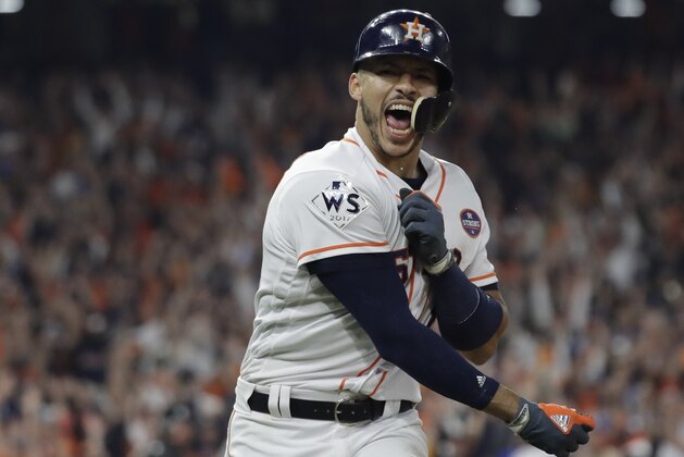 Houston Astros' Carlos Correa celebrates his two-run home run during the seventh inning of Game 5 of baseball's World Series against the Los Angeles Dodgers Sunday, Oct. 29, 2017, in Houston. (AP Photo/David J. Phillip)