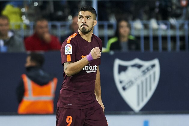 MALAGA, SPAIN - MARCH 10:  Luis Suarez of FC Barcelona celebrates after scoring goal during the La Liga match between Malaga and Barcelona at Estadio La Rosaleda on March 10, 2018 in Malaga, Spain.  (Photo by Aitor Alcalde/Getty Images)