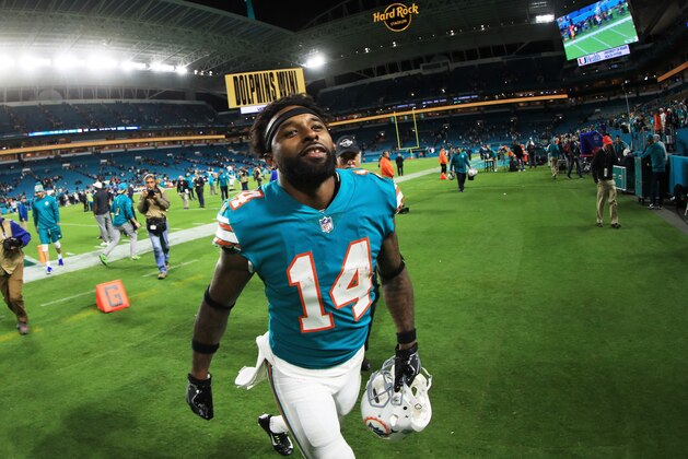 MIAMI GARDENS, FL - DECEMBER 11:  Jarvis Landry #14 of the Miami Dolphins celebrates their 27 to 20 win over the New England Patriots at Hard Rock Stadium on December 11, 2017 in Miami Gardens, Florida.  (Photo by Mike Ehrmann/Getty Images)