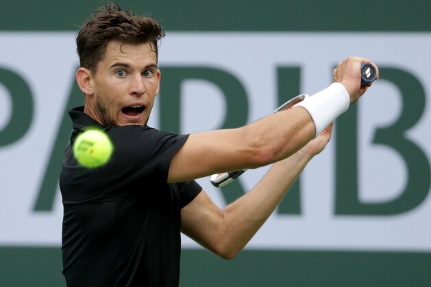 INDIAN WELLS, CA - MARCH 10:  Dominic Thiem of Austria returns a backhand to Stefanos Tsitsipas of Greece during the BNP Paribas Open on March 10, 2018 at the Indian Wells Tennis Garden in Indian Wells, California.  (Photo by Jeff Gross/Getty Images)