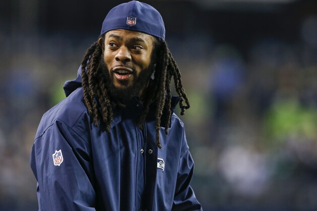 SEATTLE, WA - DECEMBER 03: Injured cornerback Richard Sherman of the Seattle Seahawks smiles from the sidelines before the game against the Philadelphia Eagles at CenturyLink Field on December 3, 2017 in Seattle, Washington. (Photo by Otto Greule Jr /Getty Images)