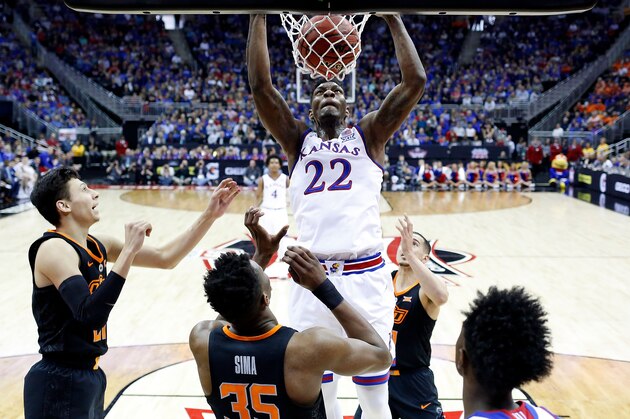 KANSAS CITY, MO - MARCH 08:  Silvio De Sousa #22 of the Kansas Jayhawks dunks during the Big 12 Basketball Tournament quarterfinal game against the Oklahoma State Cowboys at the Sprint Center on March 8, 2018 in Kansas City, Missouri.  (Photo by Jamie Squire/Getty Images)