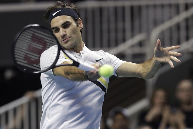 Roger Federer, of Switzerland, returns a shot against Jack Sock during an exhibition tennis match in San Jose, Calif., Monday, March 5, 2018. (AP Photo/Jeff Chiu)