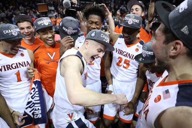 NEW YORK, NY - MARCH 10:  Tournament MVP Kyle Guy #5 of the Virginia Cavaliers celebrates with teammates after defeating the North Carolina Tar Heels 71-63 during the championship game of the 2018 ACC Men's Basketball Tournament at Barclays Center on March 10, 2018 in the Brooklyn borough of New York City.  (Photo by Abbie Parr/Getty Images)
