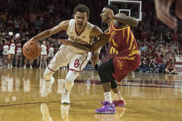 NORMAN, OK - MARCH 2:  Trae Young #11 of the Oklahoma Sooners drives around Donovan Jackson #4 of the Iowa State Cyclones during the second half of a NCAA college basketball game at the Lloyd Noble Center on March 2, 2018 in Norman, Oklahoma. (Photo by J Pat Carter/Getty Images)