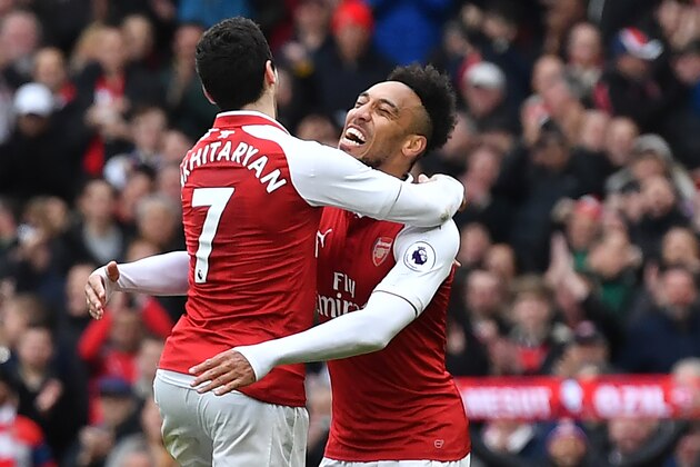 Arsenal's Armenian midfielder Henrikh Mkhitaryan (L) celebrates with Arsenal's Gabonese striker Pierre-Emerick Aubameyang after scoring their third goal during the English Premier League football match between Arsenal and Watford at the Emirates Stadium in London on March 11, 2018. / AFP PHOTO / Ben STANSALL / RESTRICTED TO EDITORIAL USE. No use with unauthorized audio, video, data, fixture lists, club/league logos or 'live' services. Online in-match use limited to 75 images, no video emulation. No use in betting, games or single club/league/player publications. / (Photo credit should read BEN STANSALL/AFP/Getty Images) Arsenal's Armenian midfielder Henrikh Mkhitaryan (L) celebrates with Arsenal's Gabonese striker Pierre-Emerick Aubameyang after scoring their third goal during the English Premier League football match between Arsenal and Watford at the Emirates Stadium in London on March 11, 2018. / AFP PHOTO / Ben STANSALL / RESTRICTED TO EDITORIAL USE. No use with unauthorized audio, video, data, fixture lists, club/league logos or 'live' services. Online in-match use limited to 75 images, no video emulation. No use in betting, games or single club/league/player publications. / (Photo credit should read BEN STANSALL/AFP/Getty Images)