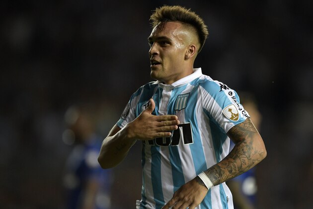 Argentina's Racing Club forward Lautaro Martinez celebrates after scoring his hat-trick against Brazil's Cruzeiro during the Copa Libertadores 2018 Group E first leg football at Juan Domingo Peron stadium in Buenos Aires, Argentina, on February 27, 2018. 
Racing won by 4-2. / AFP PHOTO / JUAN MABROMATA        (Photo credit should read JUAN MABROMATA/AFP/Getty Images)