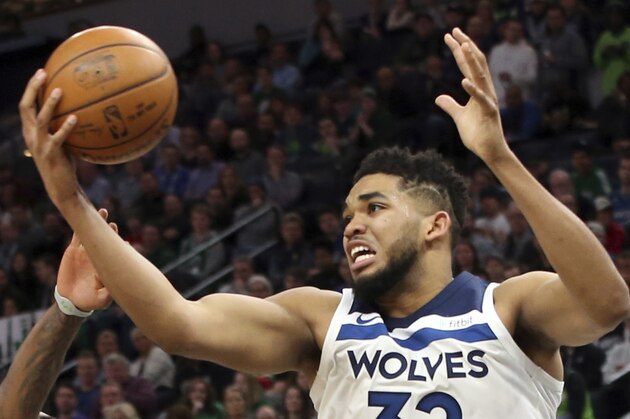 Minnesota Timberwolves' Karl-Anthony Towns plays against the Boston Celtics in the second half of an NBA basketball game Thursday, March 8, 2018, in St. Paul, Minn. (AP Photo/Jim Mone)