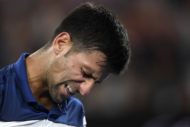 Serbia's Novak Djokovic grimaces during his fourth round match against South Korea's Chung Hyeon at the Australian Open tennis championships in Melbourne, Australia, Monday, Jan. 22, 2018. (AP Photo/Andy Brownbill)