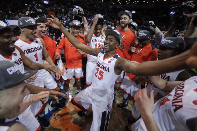 Virginia players celebrate after defeating North Carolina in the championship game of the NCAA Atlantic Coast Conference men's college basketball tournament, Saturday, March 10, 2018, in New York. (AP Photo/Julie Jacobson)