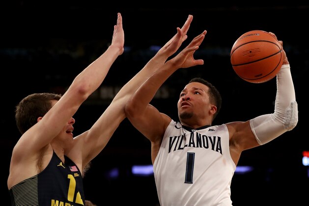NEW YORK, NY - MARCH 08: Jalen Brunson #1 of the Villanova Wildcats takes a shot as Matt Heldt #12 of the Marquette Golden Eagles defends during quarterfinals of the Big East Basketball Tournament at Madison Square Garden on March 8, 2018 in New York City.  (Photo by Elsa/Getty Images)