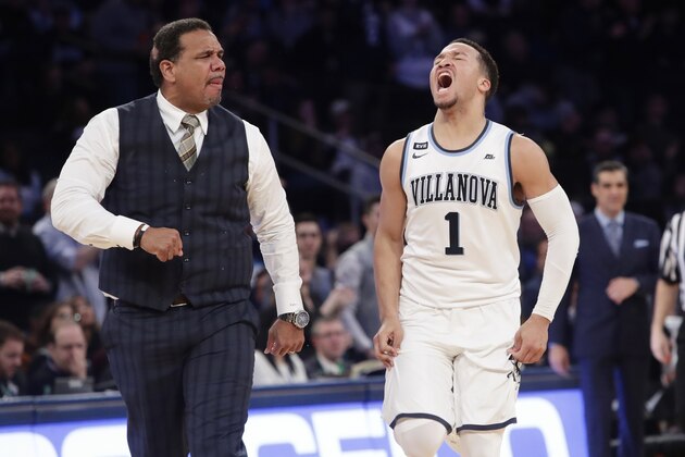 Providence coach Ed Cooley, left, and Villanova's Jalen Brunson (1) react after Brunson made a 3-point basket during the second half of an NCAA college basketball game in the Big East men's tournament final Saturday, March 10, 2018, in New York. (AP Photo/Frank Franklin II)